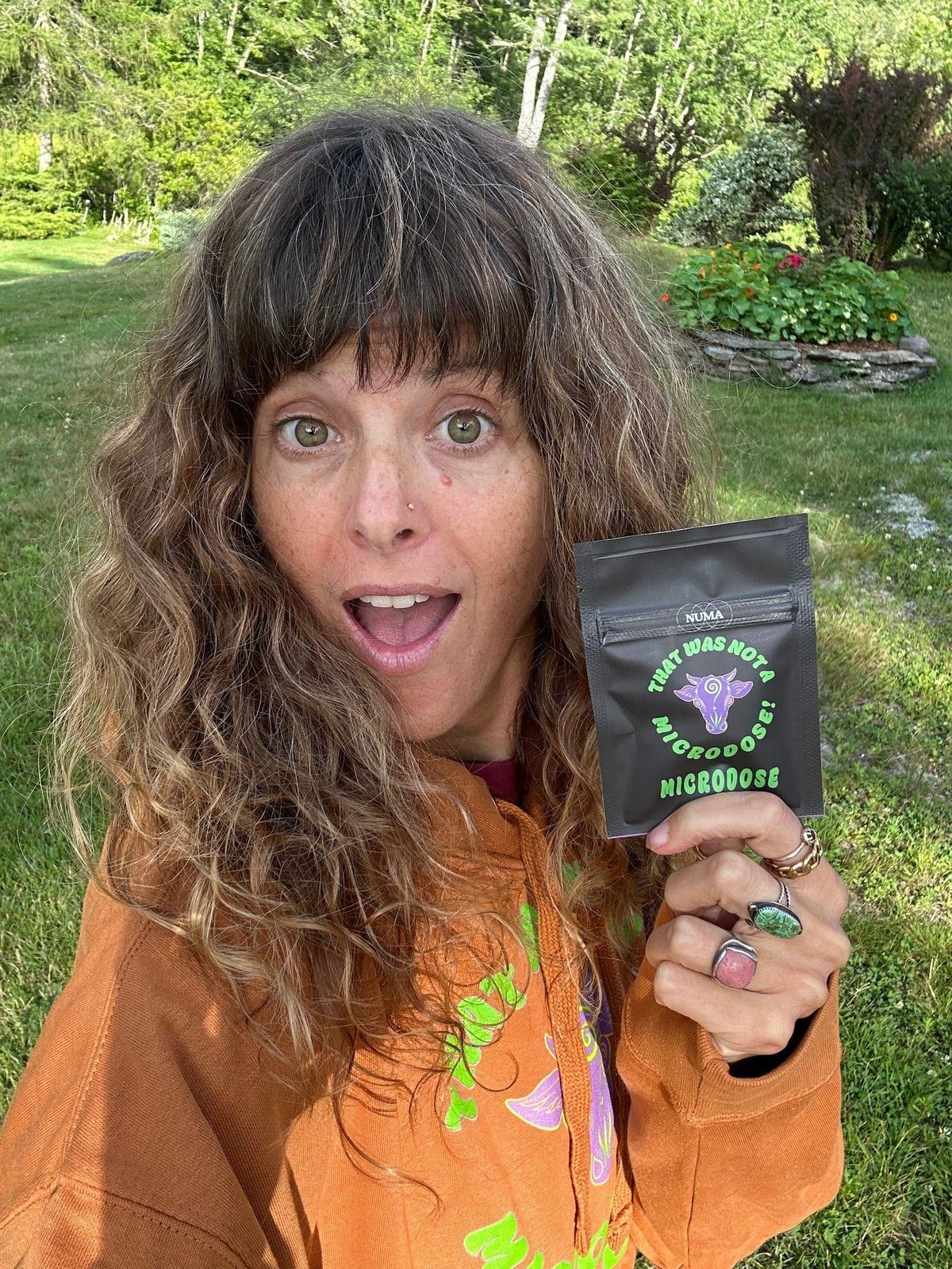 Toni holding a pouch of That Was Not a Microdose